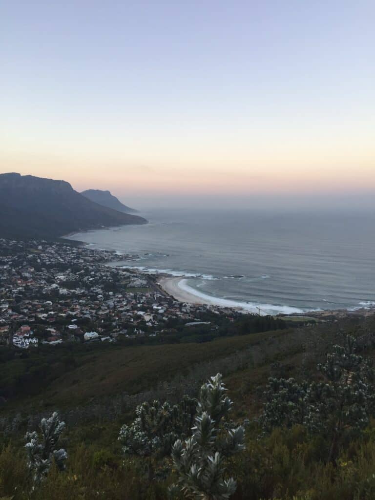 Sunrise photograph from Lion's Head, looking down Cape Town, with the ocean in the background